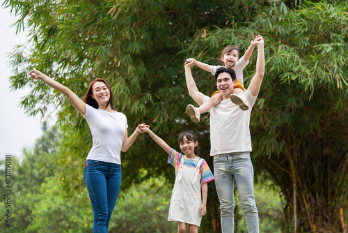 Young Asian family in the park