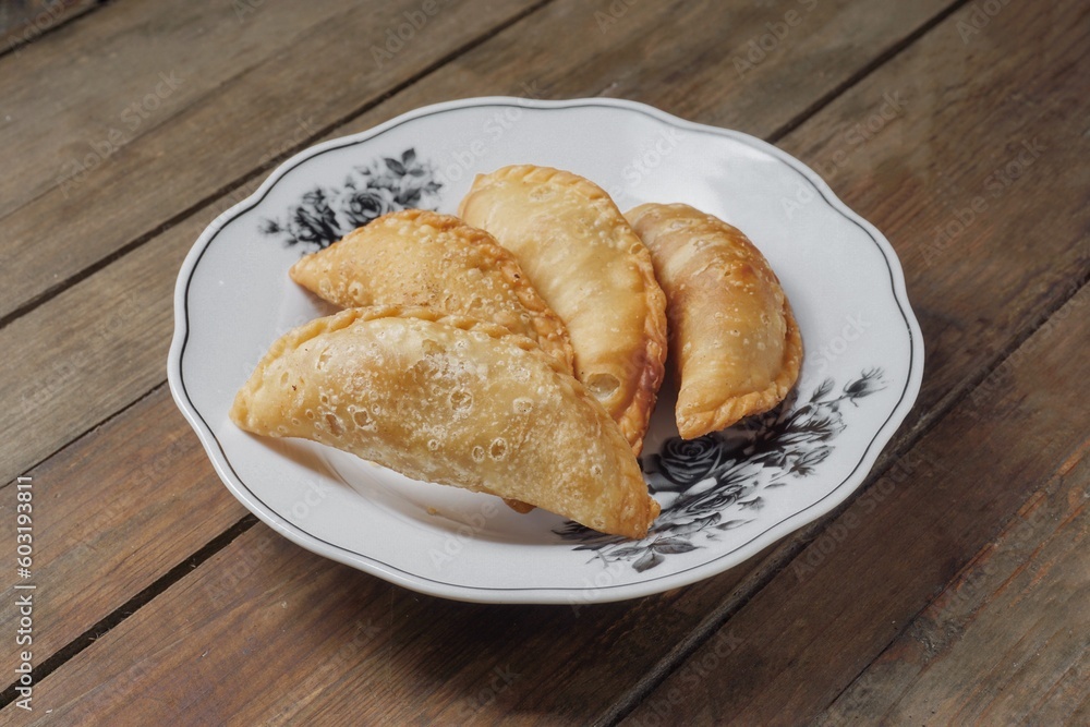 Traditional Curry Puff or Malay people called Karipap filled with potato filling Traditional Curry Puff or Malay people called Karipap filled with potato filling
