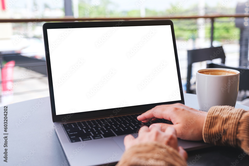 Mockup image of a woman using and working on laptop computer with blank white desktop screen - obrazy, fototapety, plakaty 