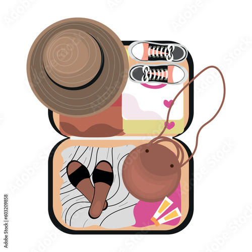 Open packed suitcase on white background. Travel concept