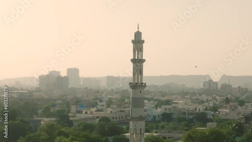 Aerial drone rotating shot of minaret of a mosque in Federal B. Area in Karachi, Pakistan at daytime. photo