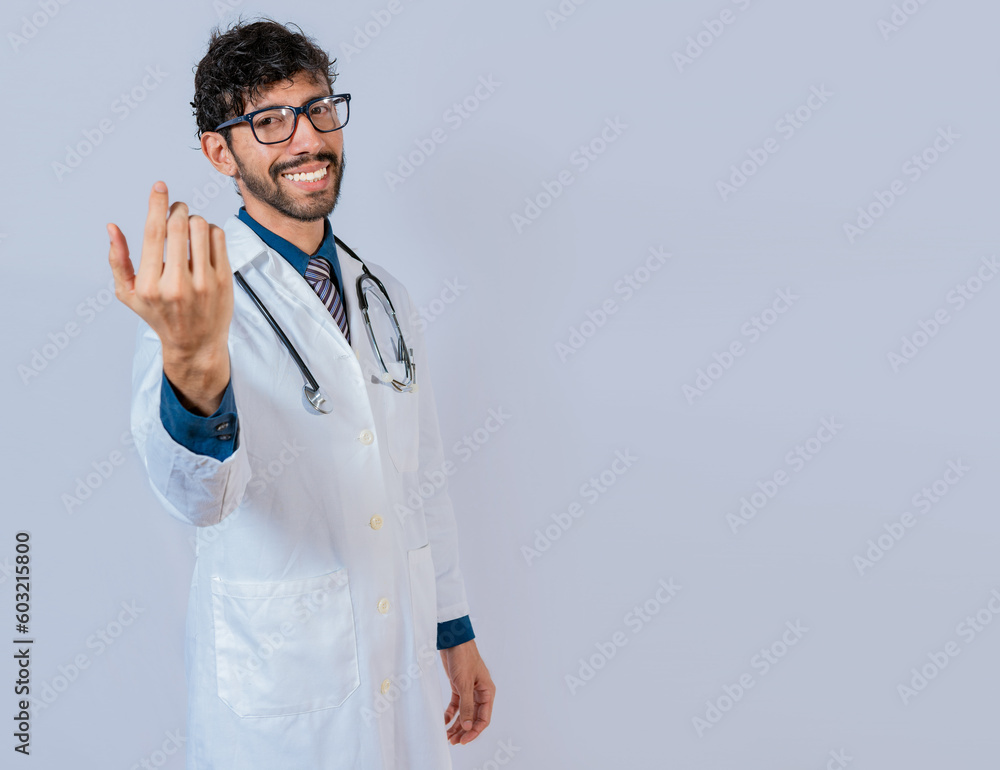 Smiling doctor inviting to come isolated. Young friendly doctor inviting to come on isolated background Smiling doctor inviting to come isolated. Young friendly doctor inviting to come on isolated background