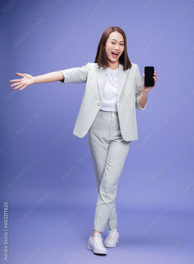 Full length photo of young Asian businesswoman on background Full length photo of young Asian businesswoman on background