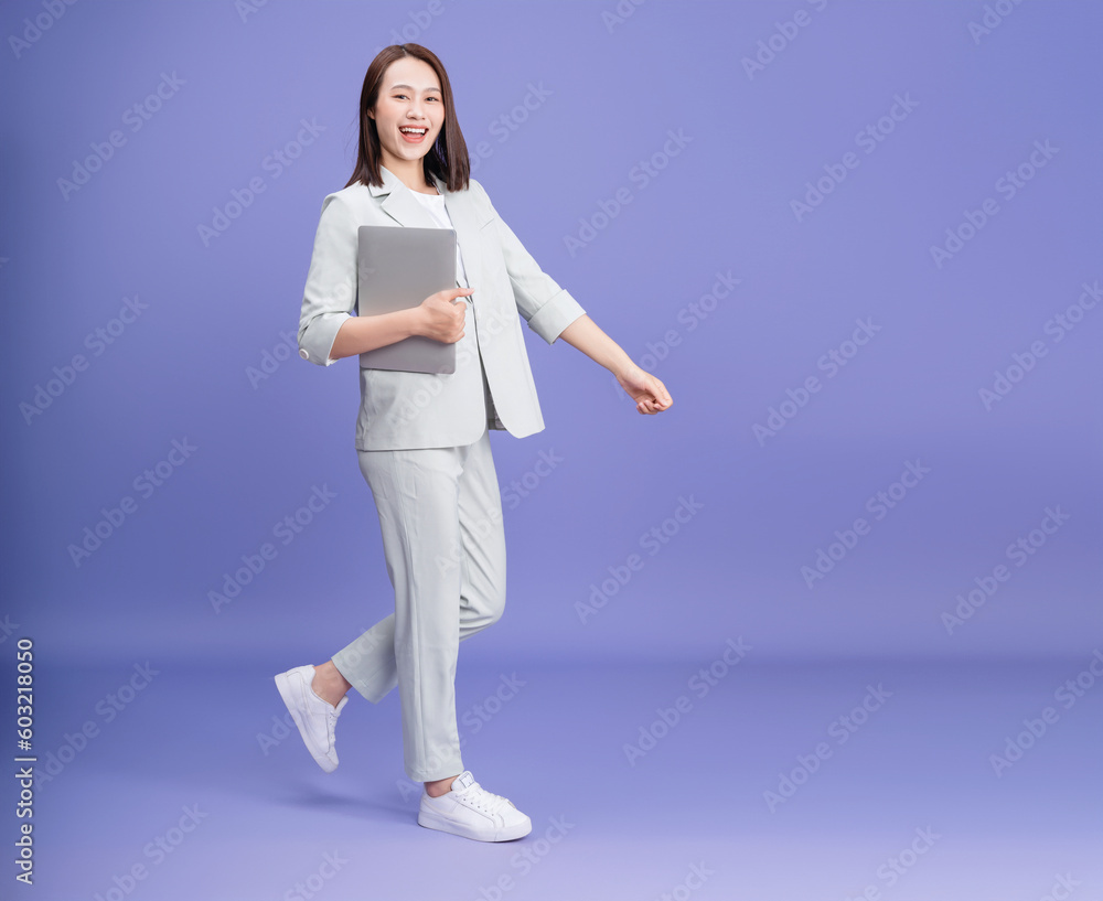 Fototapeta premium Photo of young Asian businesswoman on background