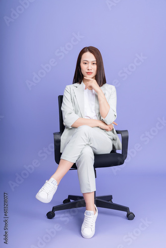 Photo of young Asian businesswoman on background © Timeimage