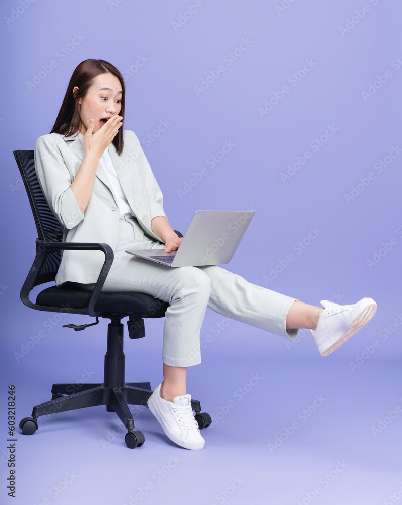 Photo of young Asian businesswoman on background Photo of young Asian businesswoman on background