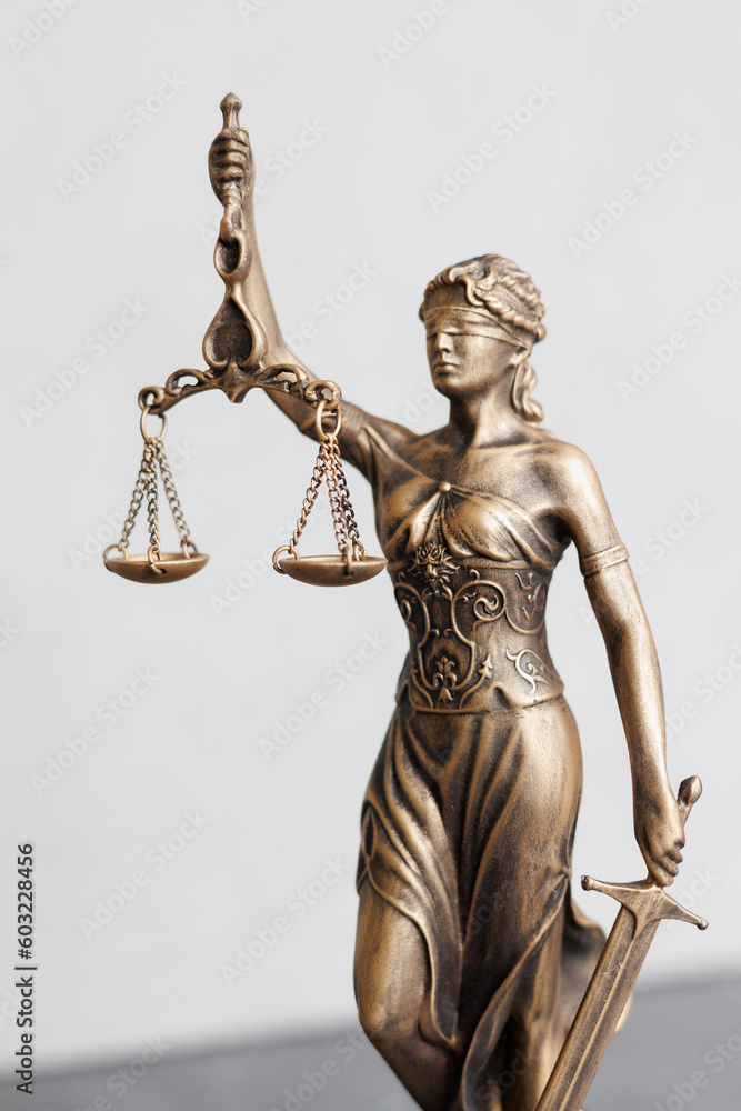 themis goddess of justice statuette on light gray background. symbol of law with scales sword in hands. legal company or university of law and judicial structure. court acquittal of the verdict themis goddess of justice statuette on light gray background. symbol of law with scales sword in hands. legal company or university of law and judicial structure. court acquittal of the verdict