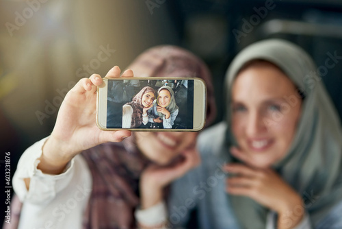 Islamic woman, friends and selfie with phone, smile and happiness for post on blog, web or social media. Happy muslim women, screen and smartphone for photography, profile picture and memory on app