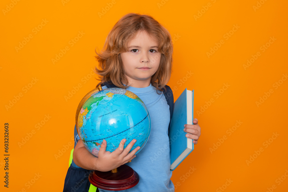 Smart child, clever school kid. School boy world globe and book. School kid 7-8 years old with book go back to school. Little student. Education concept. Smart child, clever school kid. School boy world globe and book. School kid 7-8 years old with book go back to school. Little student. Education concept.