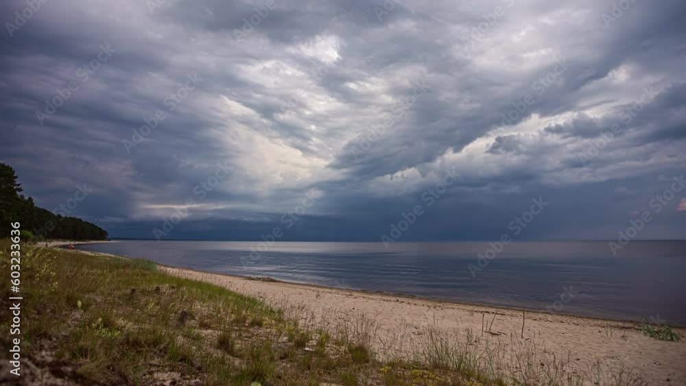Timelapse of swimmers in sea as dark clouds move overhead Timelapse of swimmers in sea as dark clouds move overhead