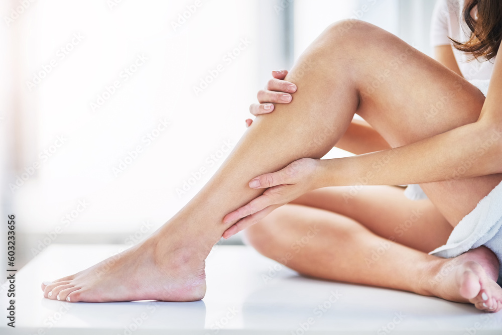 Skincare, feeling and legs of a woman after waxing, grooming and cleaning in a bathroom. Beauty, moisturize and a person touching a leg after shaving or removing body hair for a treatment at home