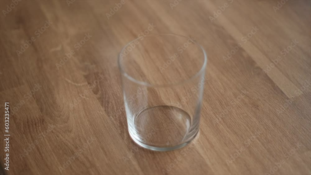 Closeup of a Glass Slowly Filling with Crystal Clear Water. Thirst Closeup of a Glass Slowly Filling with Crystal Clear Water. Thirst