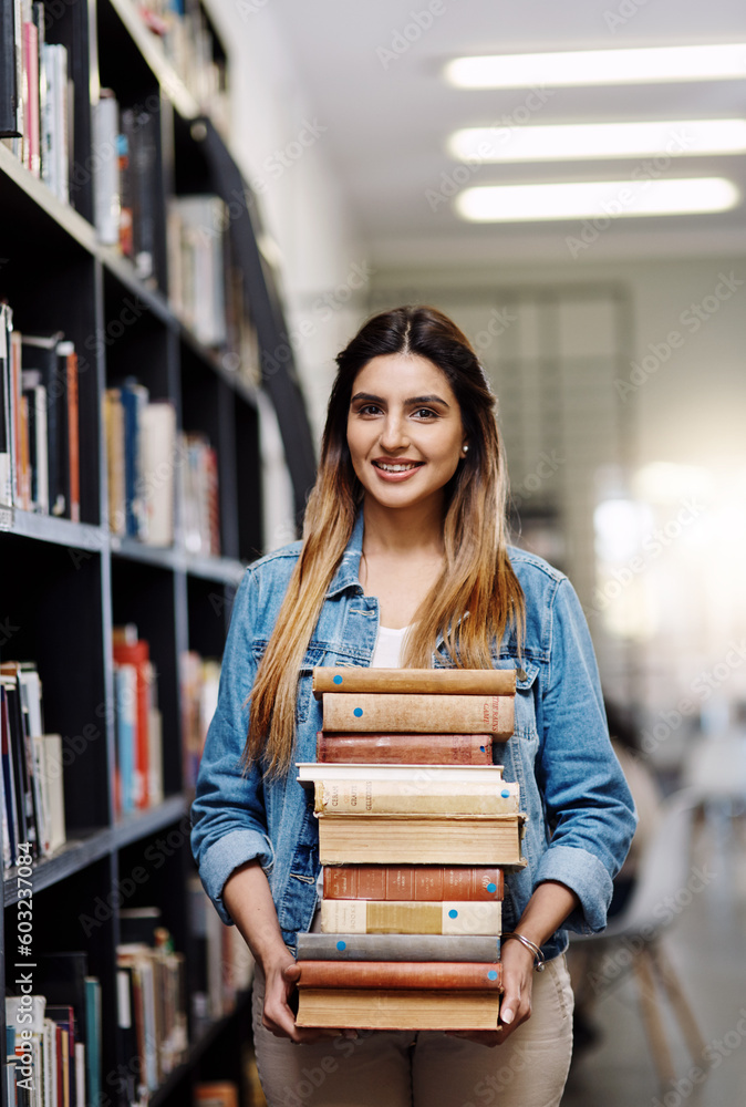 Woman in portrait, college student with stack of books in library and research, studying and learning on university campus. Female person with smile, education and scholarship with reading material Woman in portrait, college student with stack of books in library and research, studying and learning on university campus. Female person with smile, education and scholarship with reading material