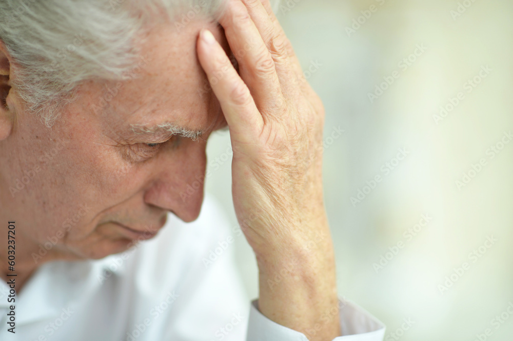 portrait of sad thinking senior man posing at home portrait of sad thinking senior man posing at home
