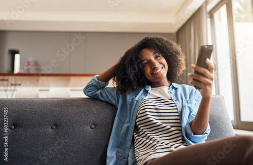 Photography Relax, black woman with remote and watching tv on sofa in living room of her home
