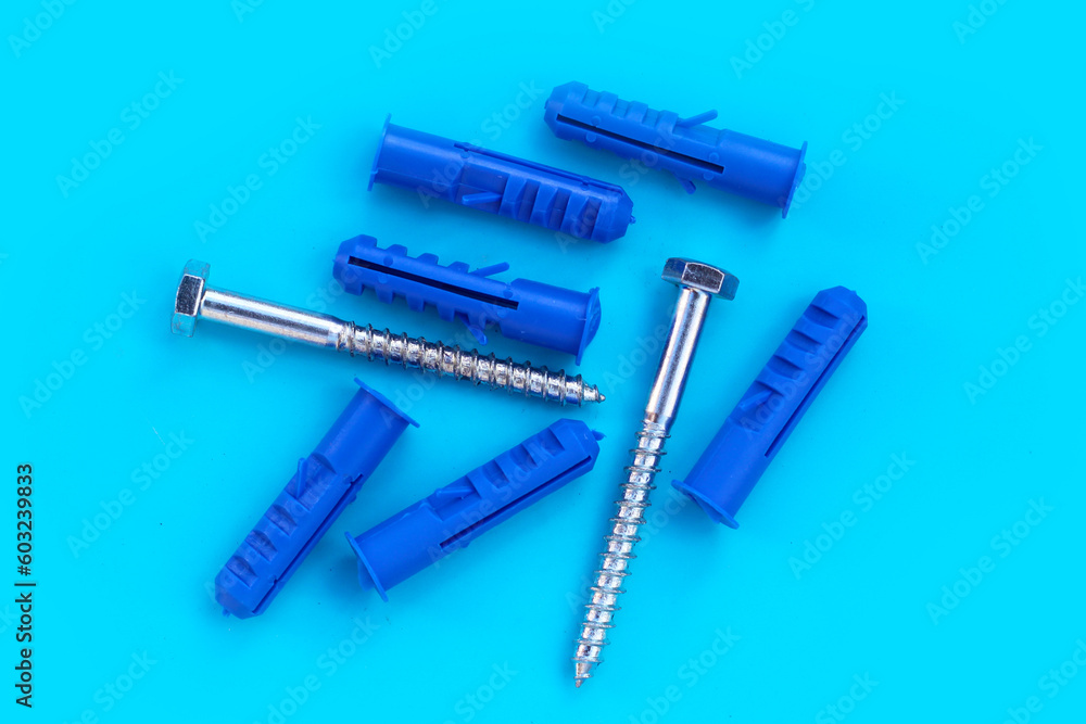 Steel screws on blue background. Steel screws on blue background.