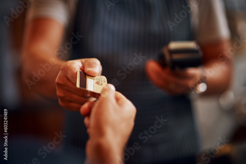Credit card, cashier and man hands with payment machine in a restaurant with customer service. Employee hand, male person and cafe barista with transaction and buying in a retail store at checkout