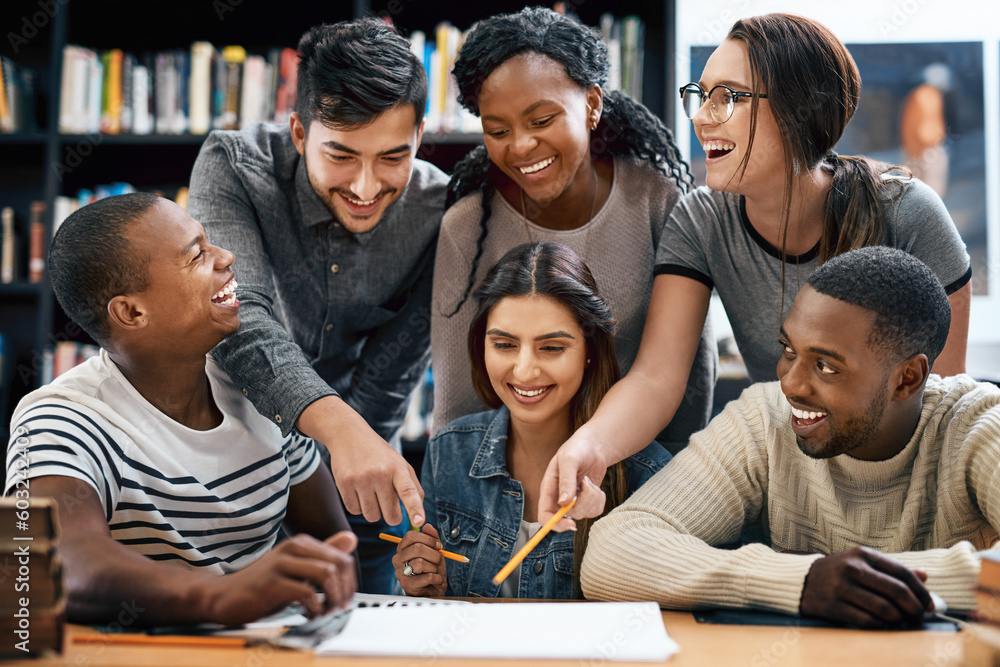 Obraz premium Students laughing in library, studying together for exam or research for project, education and teamwork. Diversity, funny and young men with women in study group, learn together and happy on campus