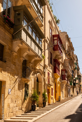Old colored windows and a balcony in the old town. Malta © Olha