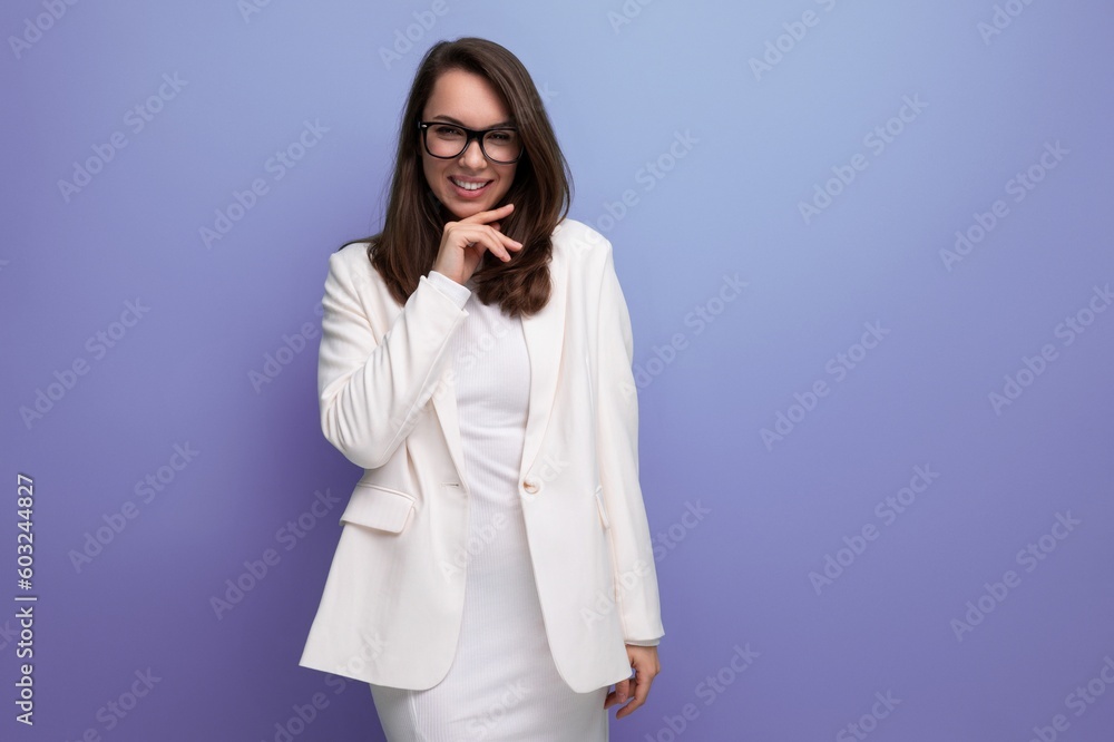 energetic brunette woman in white dress on studio background energetic brunette woman in white dress on studio background