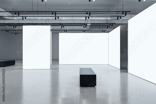 Side view on black bench in front of white blank partitions with place for advertising poster or picture frame in exhibition hall with concrete floor and grey wall background. 3D rendering, mock up