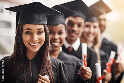 Woman, graduation and portrait of a college group with a diploma and smile outdoor. Diversity men and women students celebrate university achievement, education success and future at school event