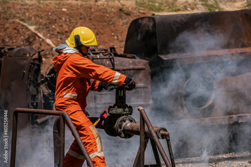 The firefighter's holding an iron ax exudes strength and determination as they prepare to tackle the challenging task ahead amidst the hazardous environment.