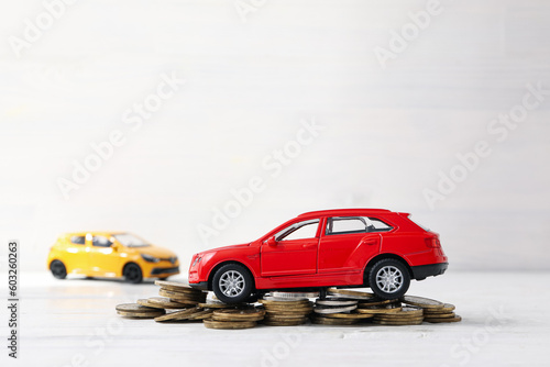 Concept of car purchase and insurance with toy car