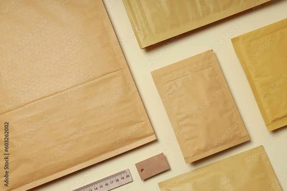 Flat lay with blank packages on beige background Flat lay with blank packages on beige background