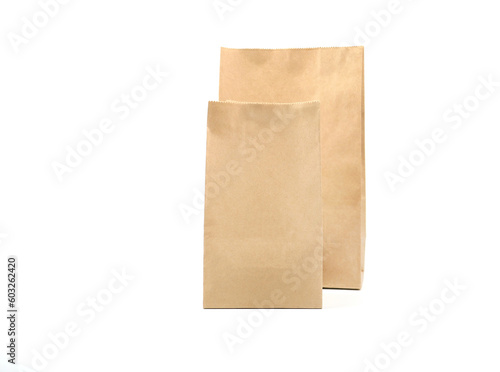 Two brown craft paper bag packaging for roasted coffee beans template isolated on a white background. Package mock-up for coffee or dry seeds product