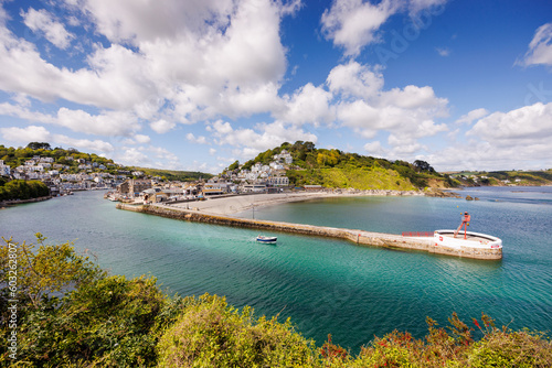 Fishing boats in the bay at Looe Harbour  and beach in Cornwall