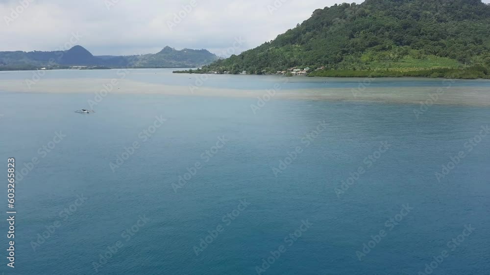 calm ocean currents during the day, beautiful island views in the port of Merak, Banten Indonesia calm ocean currents during the day, beautiful island views in the port of Merak, Banten Indonesia