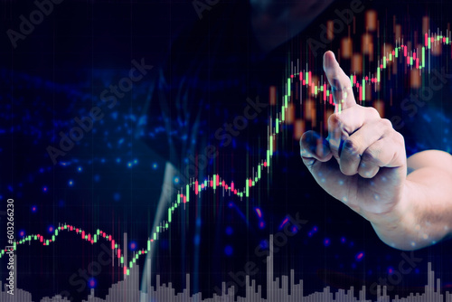 Businessman or trader showing growing virtual holographic stocks