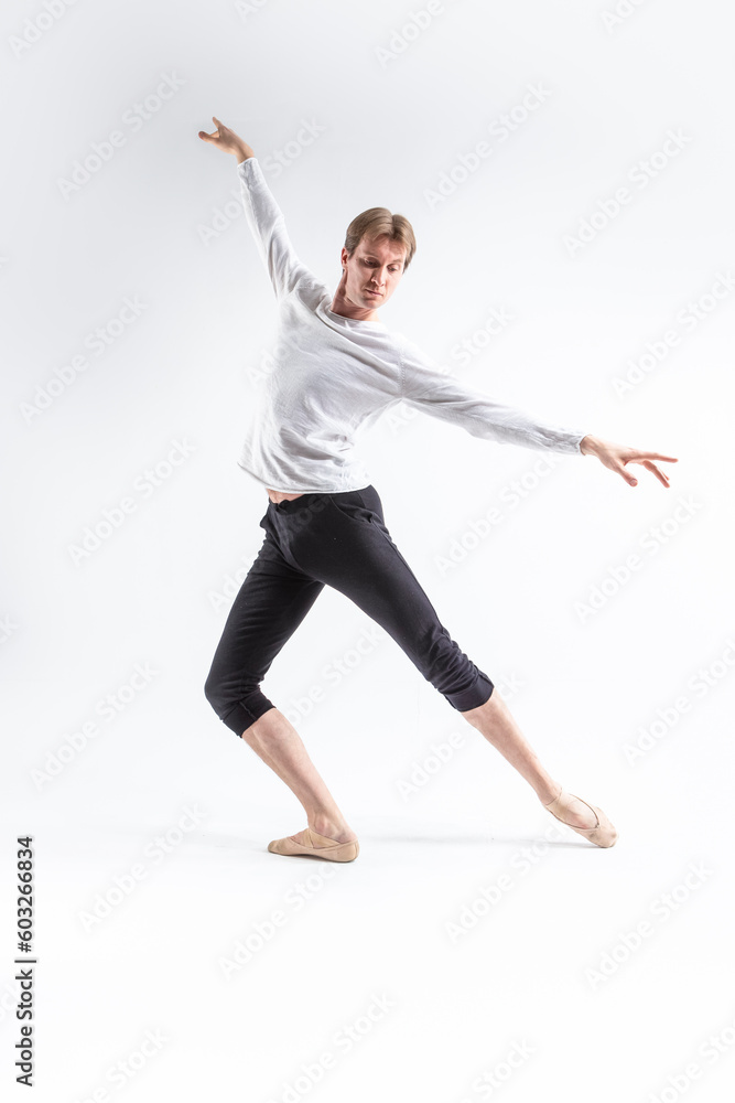 Full Length Portrait of Caucasian Young, Handsome, Sporty Athletic Ballet Dancer with Lifted Hands Over White.