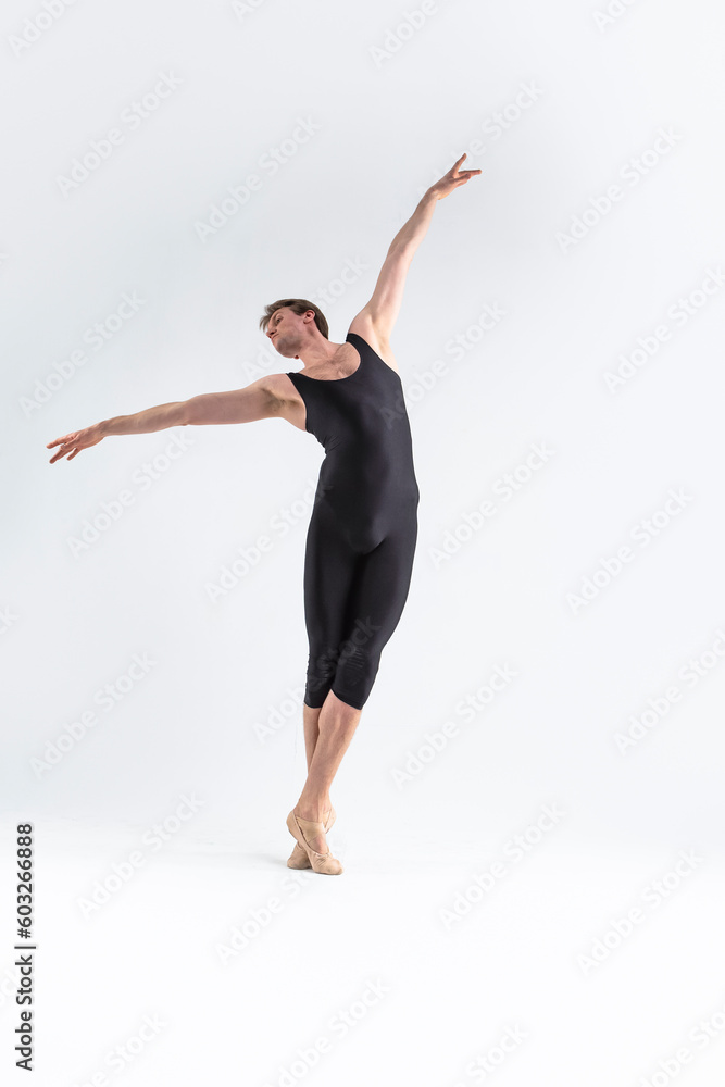 Ballet Dancer Young Athletic Man in Black Suit Posing in Stretching Dance Pose Studio