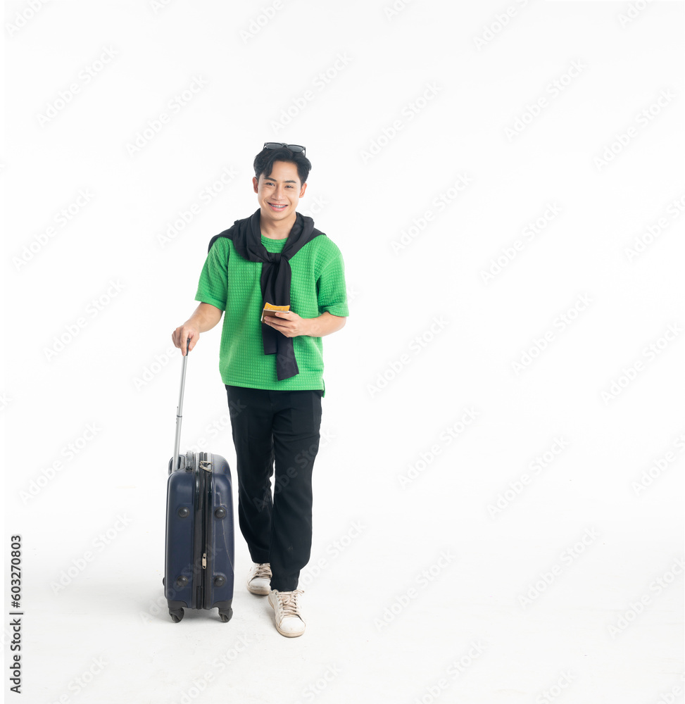 Happy young Asian man tourist man holding passport and plane ticket, make peace sign joyful with baggage going to travel on holidays isolated on white copy space background Happy young Asian man tourist man holding passport and plane ticket, make peace sign joyful with baggage going to travel on holidays isolated on white copy space background