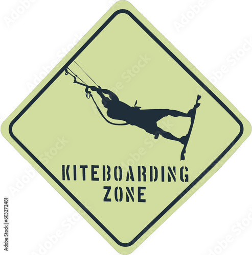 Sign of a Kiteboarding zone. Black kite board area sign on a yellow background warning about a sportive zone. Wind sport sign with flying person. Jumping kite boarder or surfer in a kitesurf area