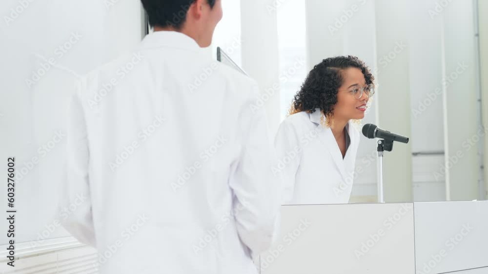 A multinational group presenting research in a classroom. A multinational group presenting research in a classroom.