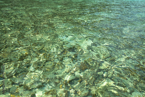 Image of the water surface of the sea in green tones