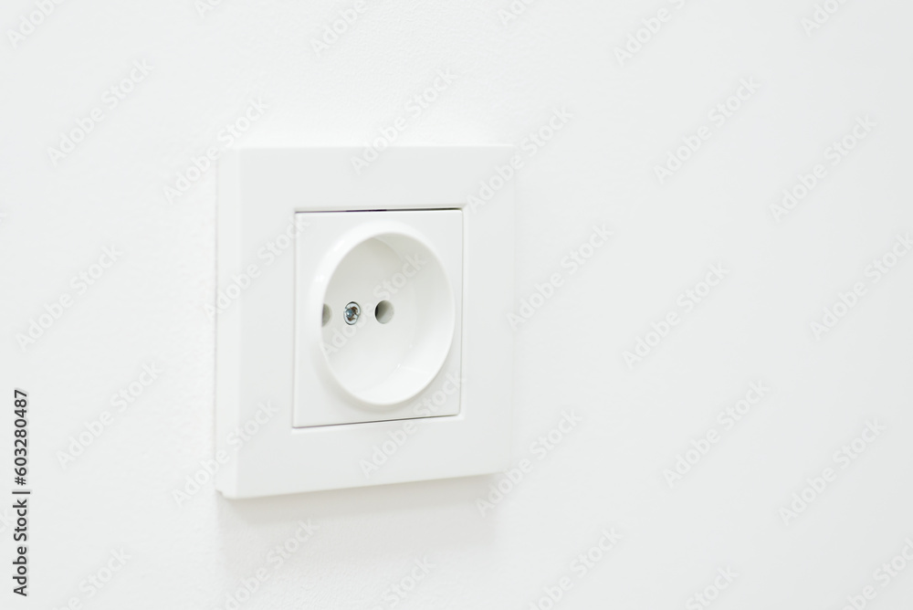 Close up of an empty socket on a white wall. Electricity concept, white outlet Close up of an empty socket on a white wall. Electricity concept, white outlet