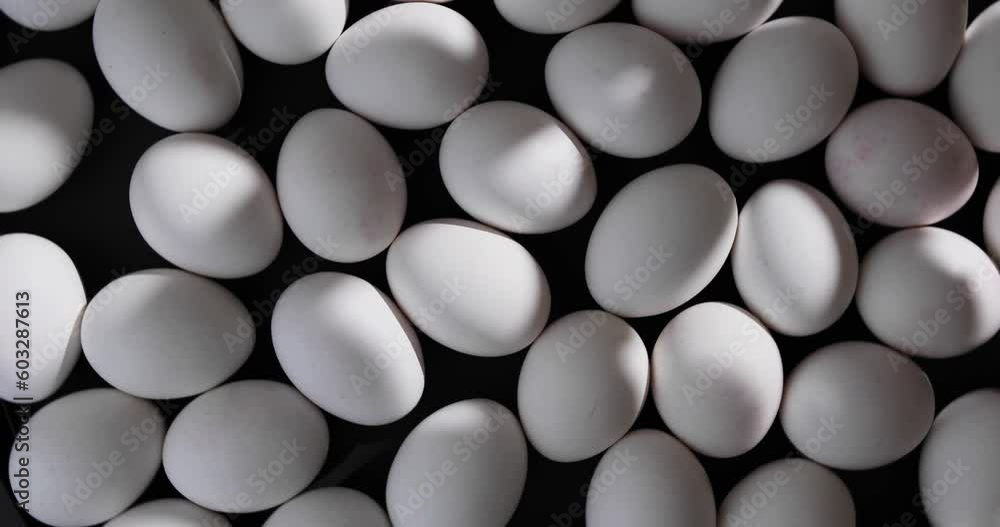 Many eggs rotate on a black background Many eggs rotate on a black background