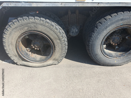 Flat tire of a heavy duty truck on the road