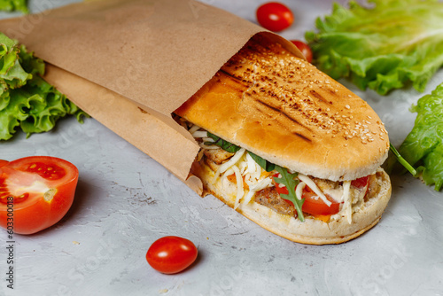 panini sandwich with crispy chicken and rucola salad