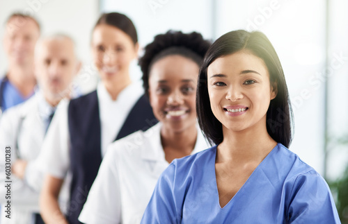 Smile, team and portrait of doctors and nurses in hospital, support and teamwork in healthcare. Health, help and medicine, confident woman doctor and group of happy medical employees in row together.