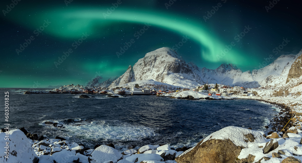 Amazing winter seascape. Beautiful north landscape with northern lights  over the A - village, Moskenes, Lofoten islands. Norway. Travel adventure Lifestyle concept