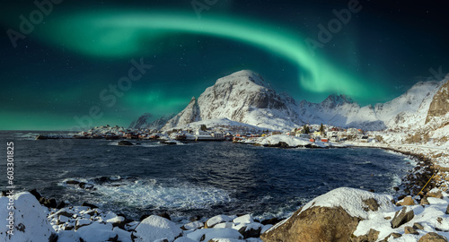 Amazing winter seascape. Beautiful north landscape with northern lights over the A - village, Moskenes, Lofoten islands. Norway. Travel adventure Lifestyle concept
