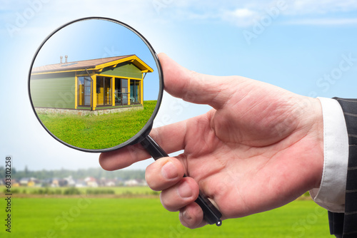 Realtor hand. House under m...