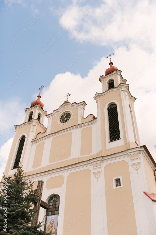 Fototapeta premium Ancient stone Catholic church decorated with small mosaics and icons, Osova, Belarus, 2023