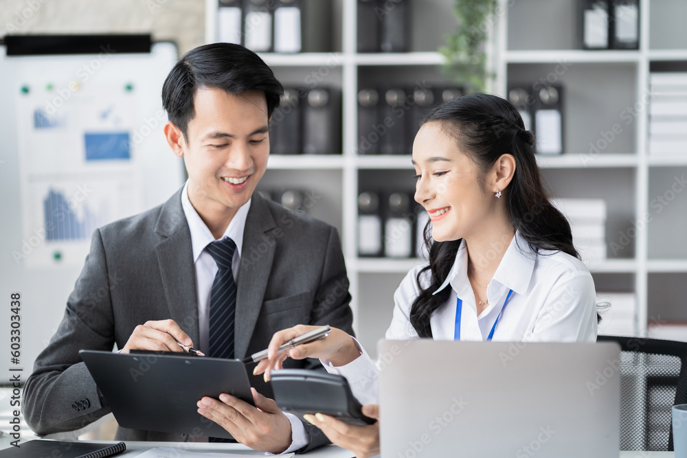 Businessmen team or financial data analysts working with tablets and laptop computers and data graphs together. Plan to analyzing projects in the office. Businessmen team or financial data analysts working with tablets and laptop computers and data graphs together. Plan to analyzing projects in the office.