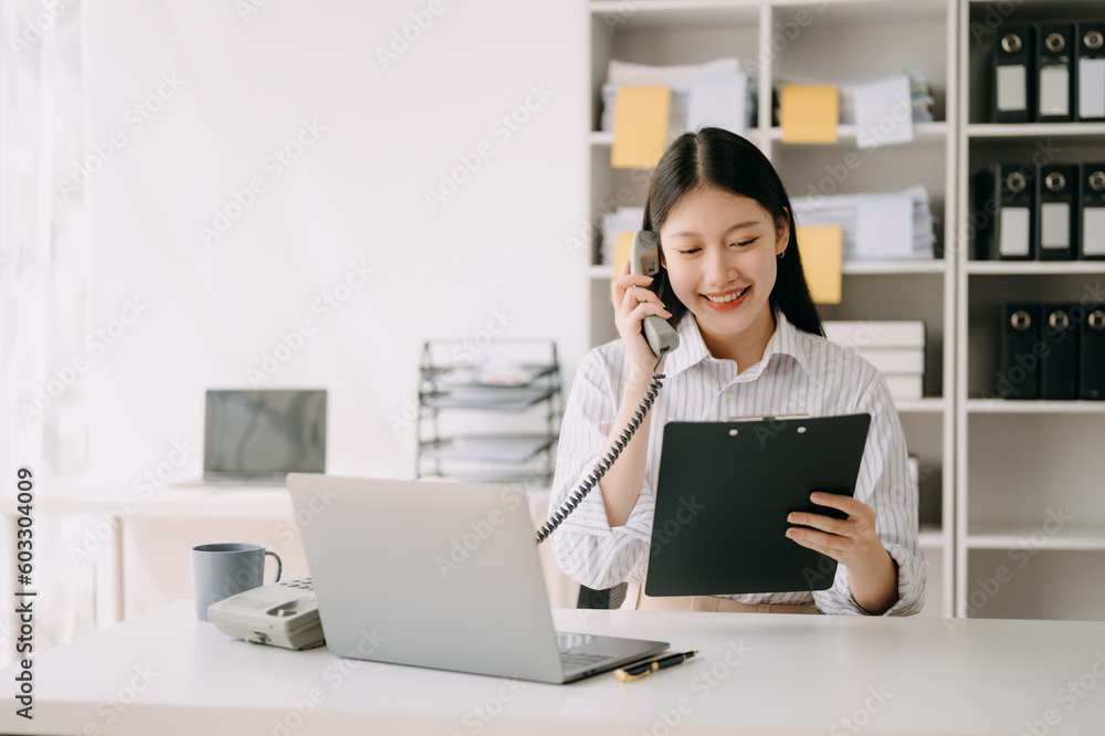 Happy asian business woman have the joy of talking on the smartphone, tablet and laptopon the office . Happy asian business woman have the joy of talking on the smartphone, tablet and laptopon the office .